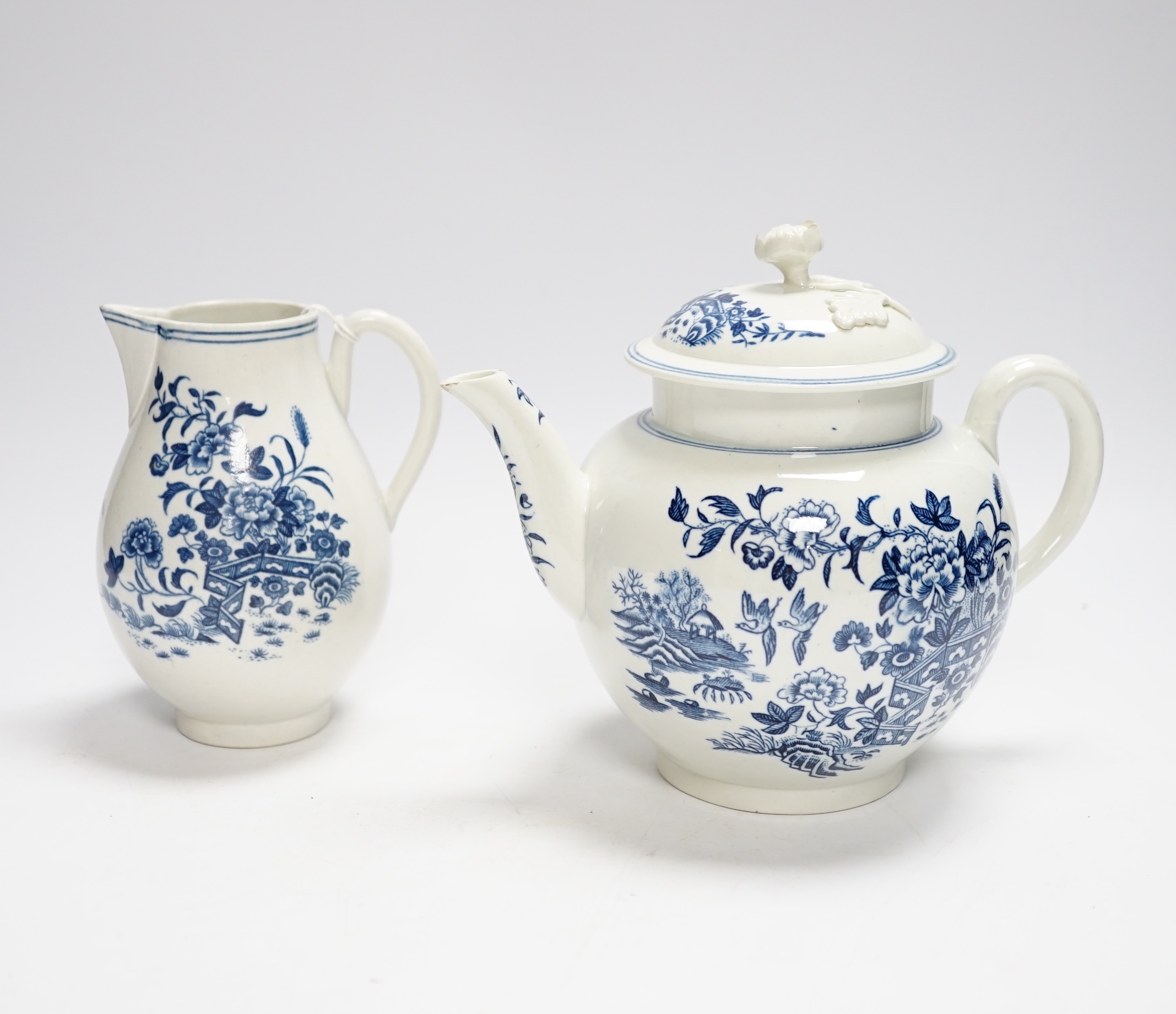 A Worcester fence pattern teapot and cover and a similar milk jug c.1775, largest 19cm wide